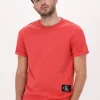 Calvin Klein T-shirt Badge Turn Up Sleeve En Orange Retour gratuit en magasin. 19